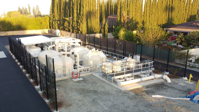 Aerial view of the partially below grade 4.0 MGD Serrano Water District PFAS Plant showing the exterior screen walls