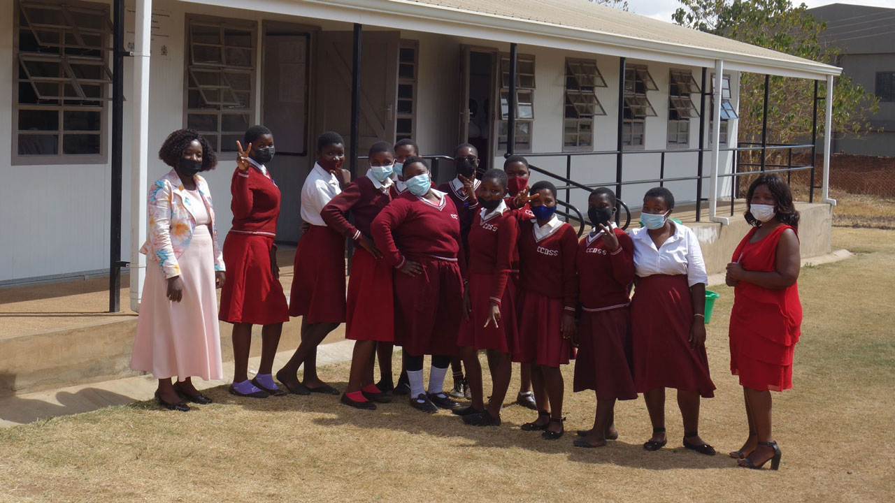 Female students posing outside the Chilambula Urban CDSS