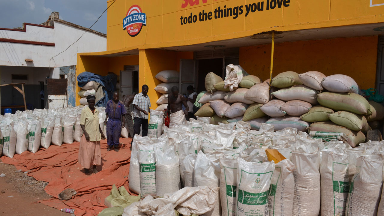 Pile of grain bags available for sale outside a store in Uganda