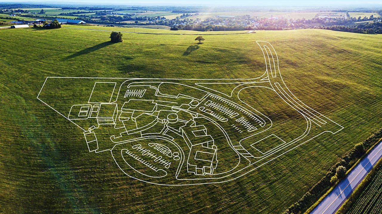 2D drawing of a Tetra Tech master plan for a wastewater treatment overlaying an aerial photo of a field