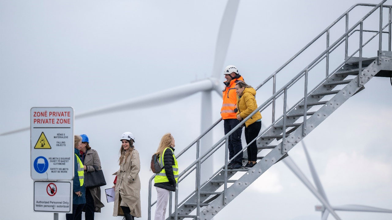 Members of the Association of Women in Energy Sector of Kosovo (AWESK) walking down stairs while visiting the SOWI wind farm and ProSolar park