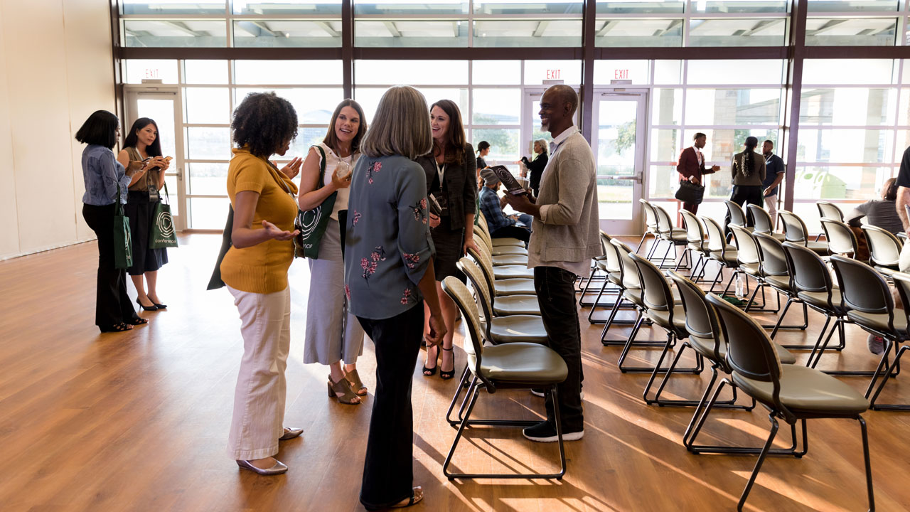 A group of participants networking during the public meeting