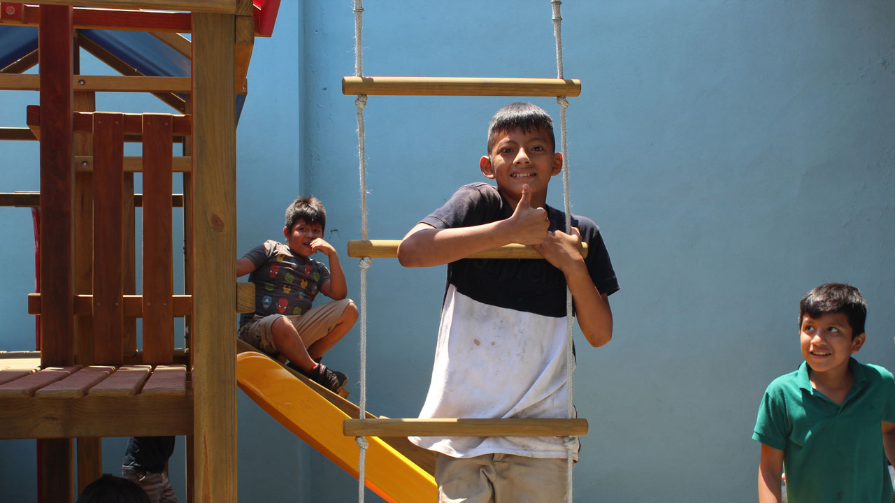 A group of children in Malacatan have a playground to play on, thanks to UMG’s crime prevention through environmental design (CPTED)